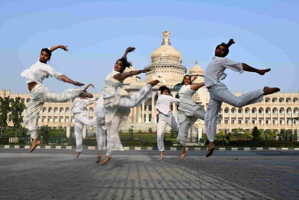 Dancers performing in front of Vidhana Soudha at Attakkalari India Biennial 2021-22. Photo: Samuel Rajkumar